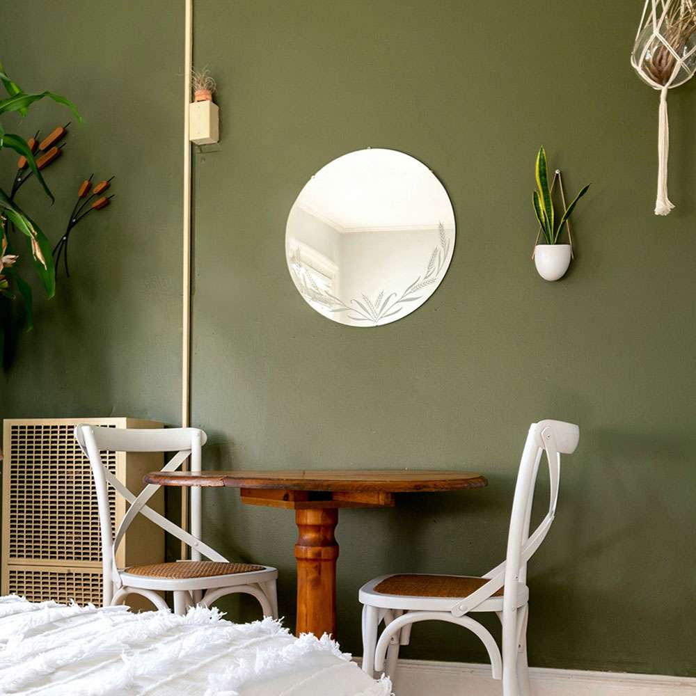 Image of a green wall painted in a bedroom as an example of how Residential Painting can improve the feeling of a space